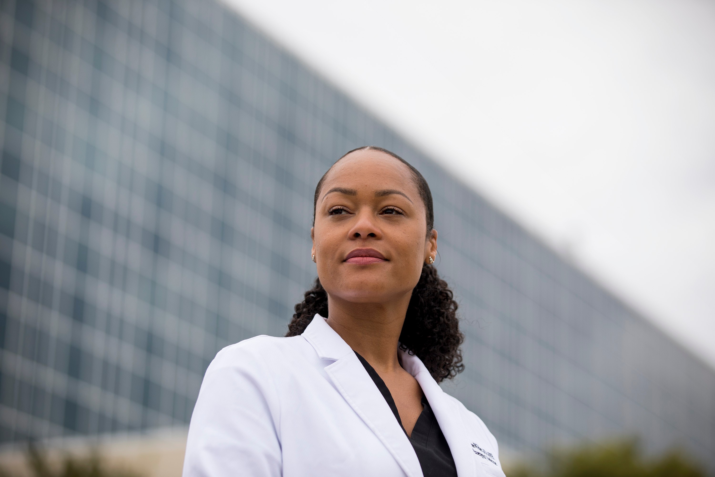 Dr. Marcee Wilder stands with the hospital in the background.