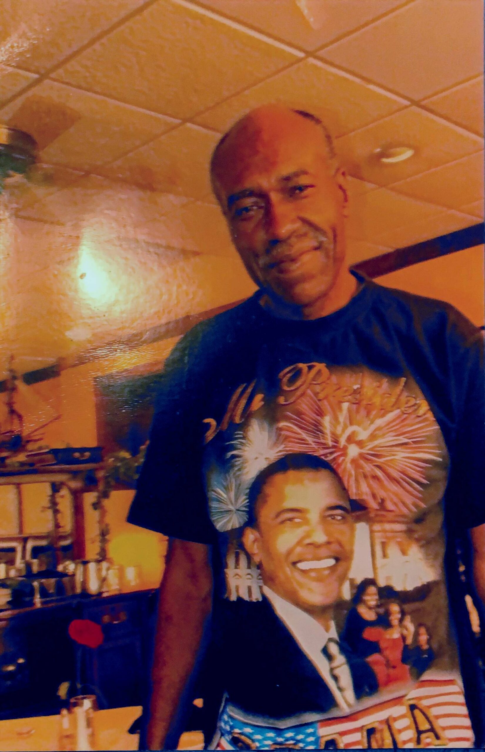 Photo of a man wearing an Obama t-shirt