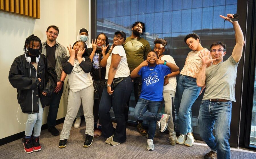 students and adults pose together at martin luther king library