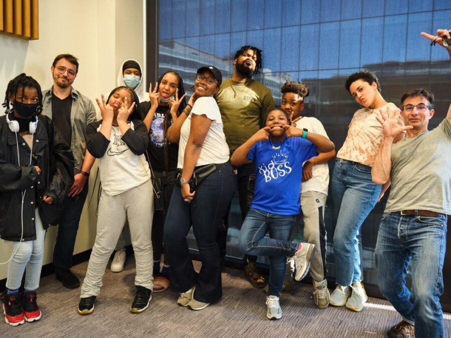 students and adults pose together at martin luther king library