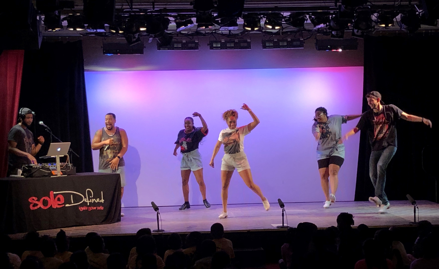 Photo of a group of performers on stage