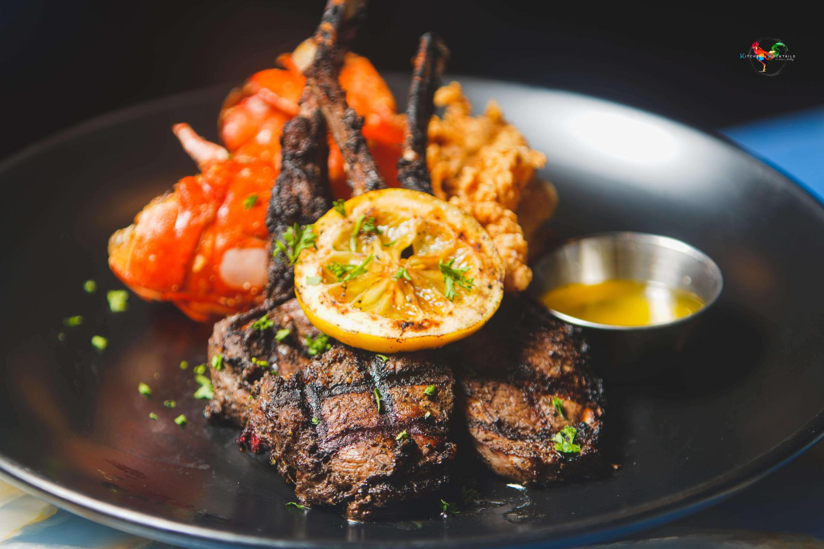 Photo showing grilled meet and vegetables on a plate.